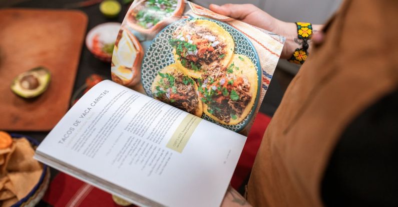 Recipes - A Person Reading a Cookbook
