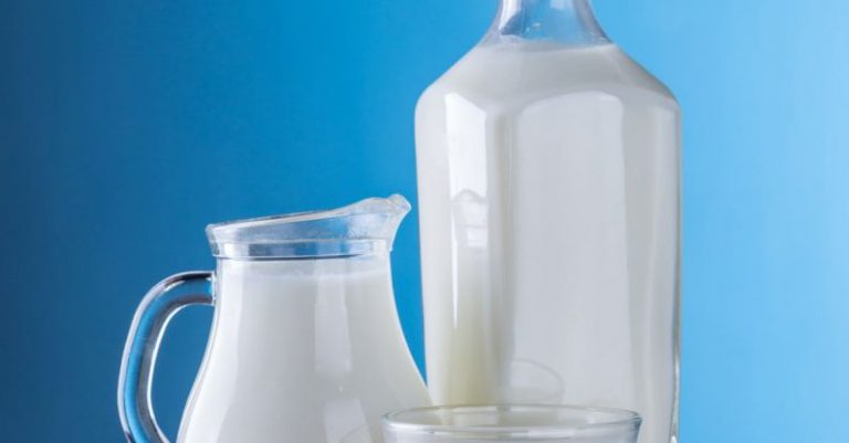 Dairy Products - Close-up of Milk Against Blue Background